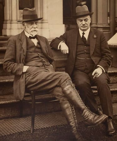 man-in-black-suit-sitting-on-stairs-mqjcwimulfg Thomas Baker and JJ Rouse, Kodak Australasia Pty Ltd, Abbotsford